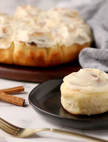 Freshly baked cinnamon rolls with cream cheese frosting