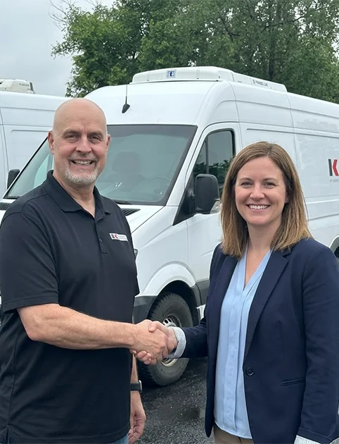 Kittelson Marketing team members in front of delivery van